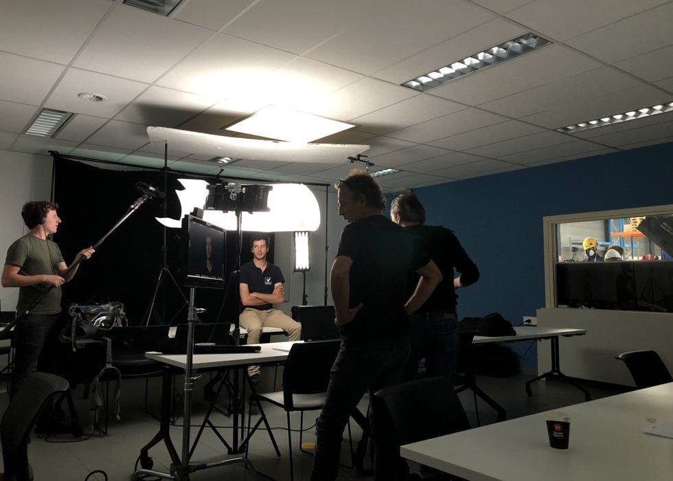 Image of a studio where we do a casting. Our team members is setting up the technical part.